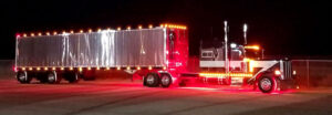 Peterbilt semi truck tractor trailer with reefer as part of JDK Logistics nationwide freight transportation broker fleet