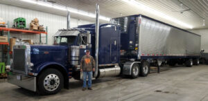 Family friend Roddy and his blue Peterbilt semi truck tractor trailer with reefer