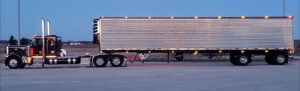 Peterbilt semi truck tractor trailer with reefer as part of JDK Logistics nationwide freight transportation broker fleet